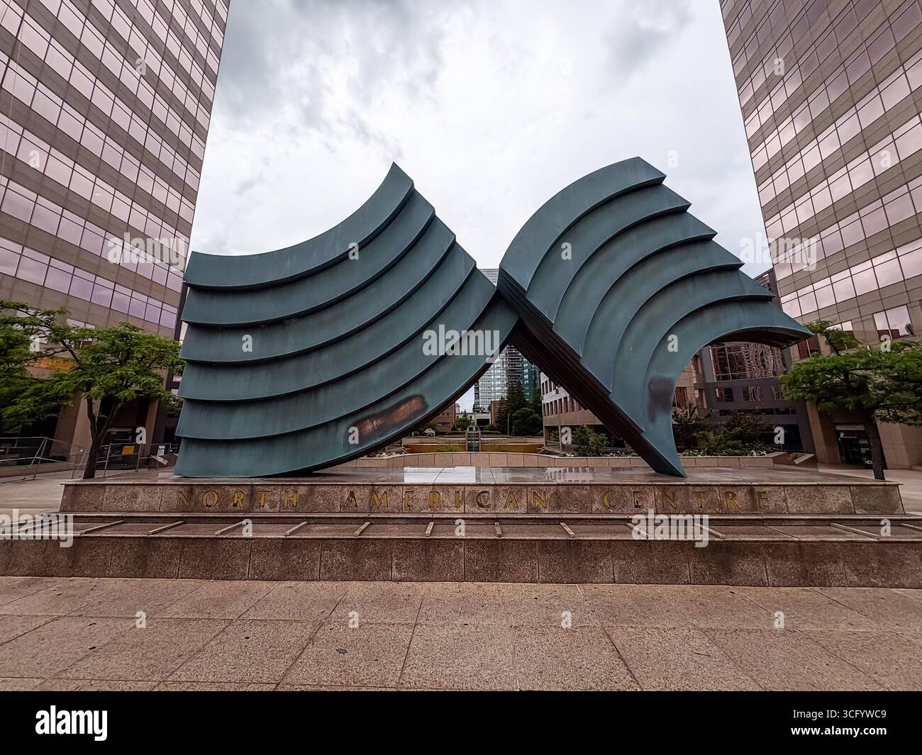 North American Centre sculpture, a prominent abstract bronze artwork by Robert Murray in downtown Toronto, Canada. Two large, curved forms are framed Stock Photo