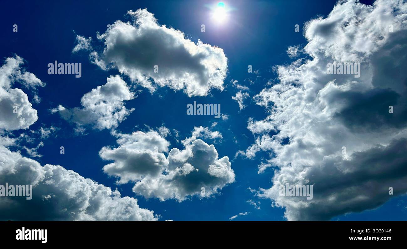 White fluffy clouds against blue sky - Smartphone Captured Stock Image