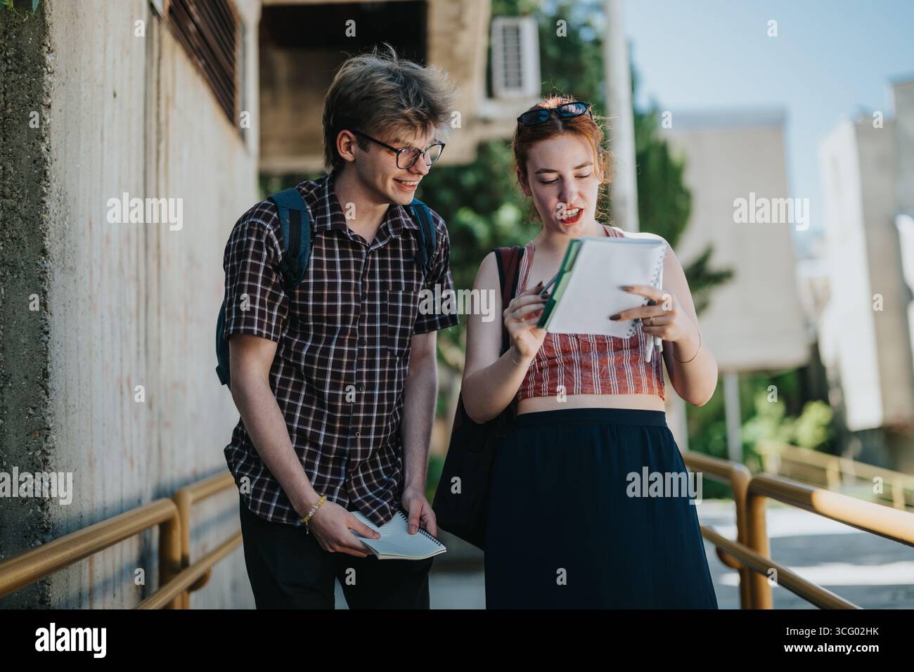 Students Collaborating Outdoors on a School Campus Stock Photo