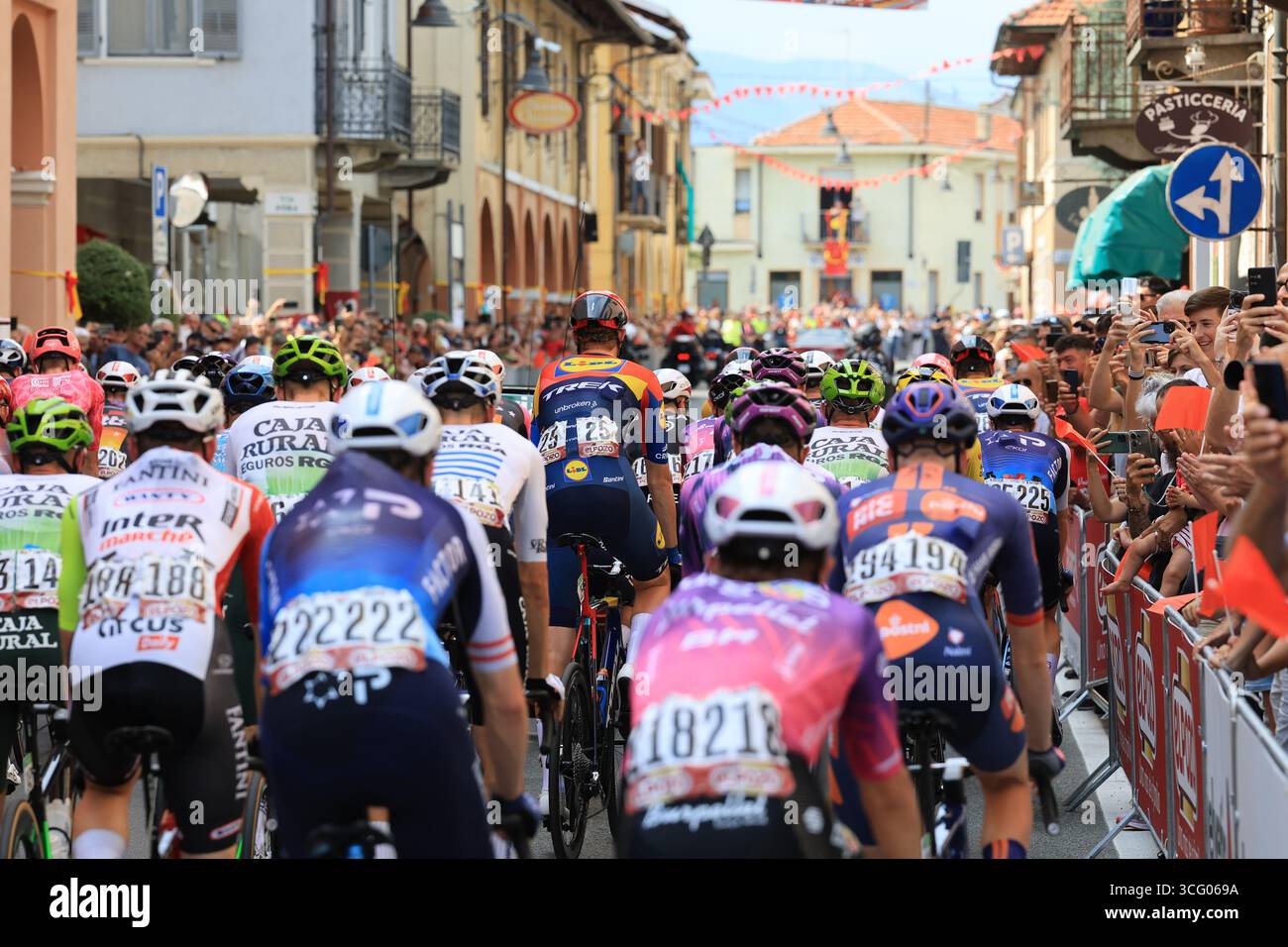 Turin, Italy. 25th Aug, 2025. 2025 UCI La Vuelta Cycling Race, Third Stage from San Maurizio Canavese to Ceres; Peloton cycles through village Credit: Action Plus Sports/Alamy Live News Stock Photo