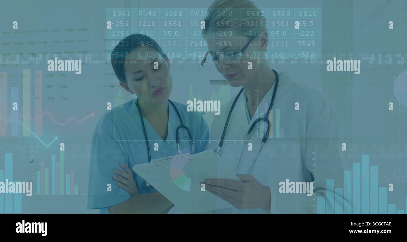 Reviewing charts, two doctors analyzing data overlays in exam room ...