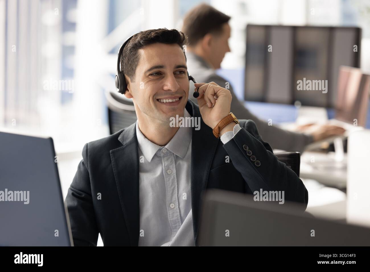 Man offering customer support, participating in virtual meeting, assisting client Stock Photo