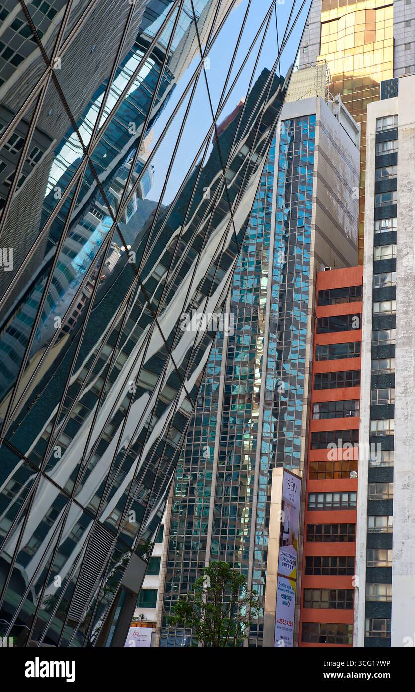 Abstract reflections and unusual angle of steel and glass high-rise ...