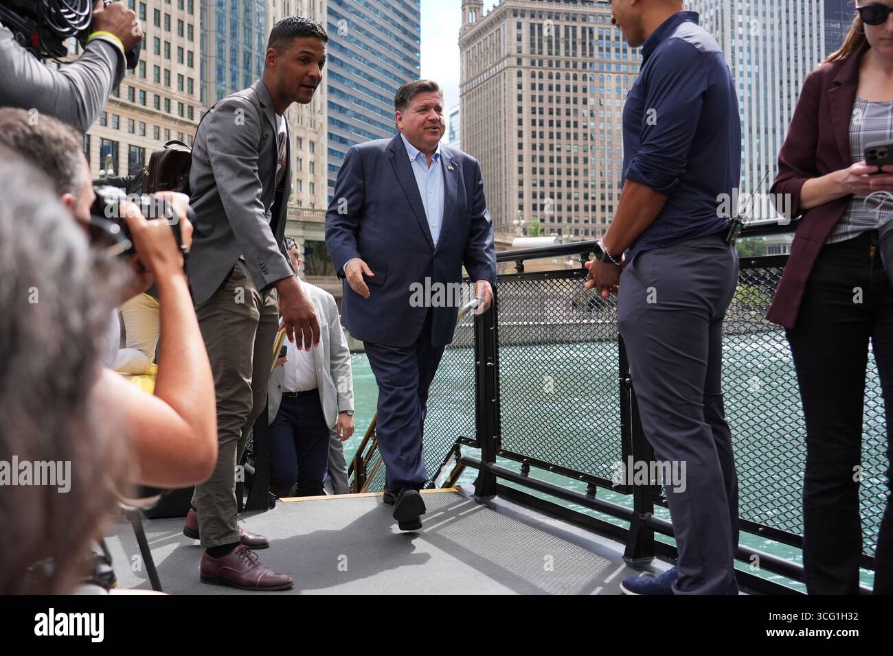 Illinois Governor JB Pritzker arrives for a news conference in a ...