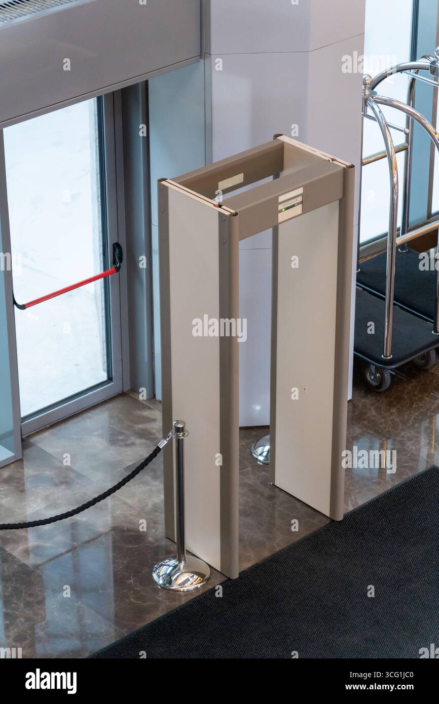 Automatic doors at a modern building entrance with a security metal ...