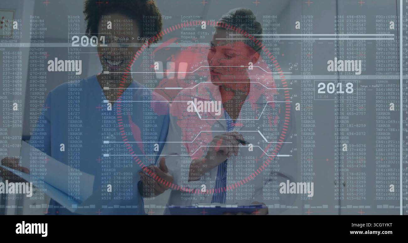 Doctor and nurse in uniform reviewing charts on clipboard at clinic ...