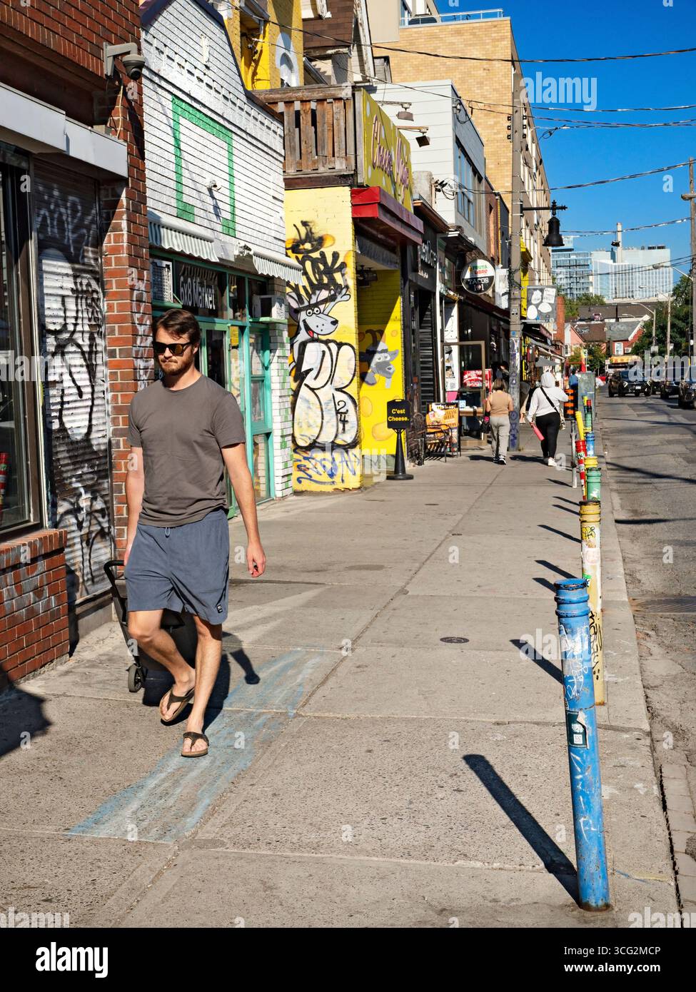 Toronto Canada  /  People strolling down Baldwin Street in the Kensington Market  Neighbourhood. Stock Photo
