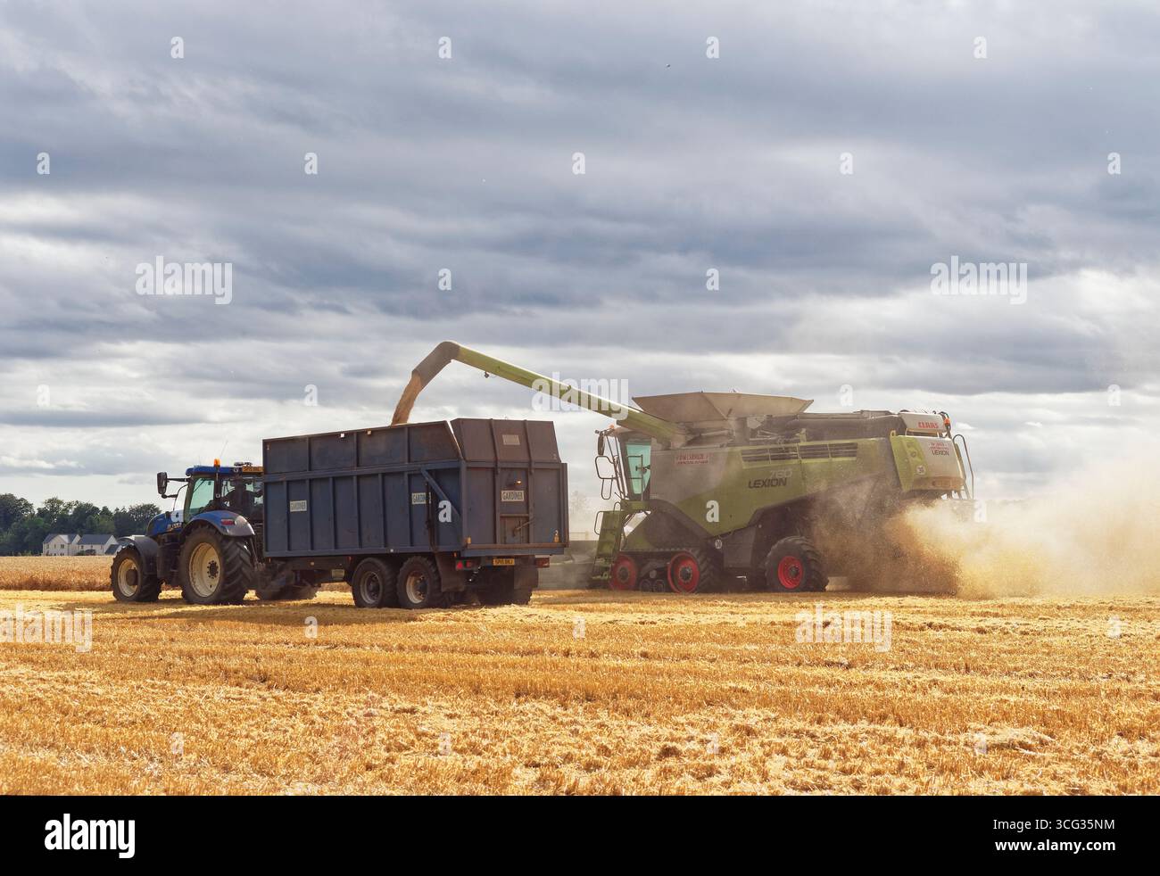 The rear view of a Claas Lexion Combine Harvester and New Holland ...