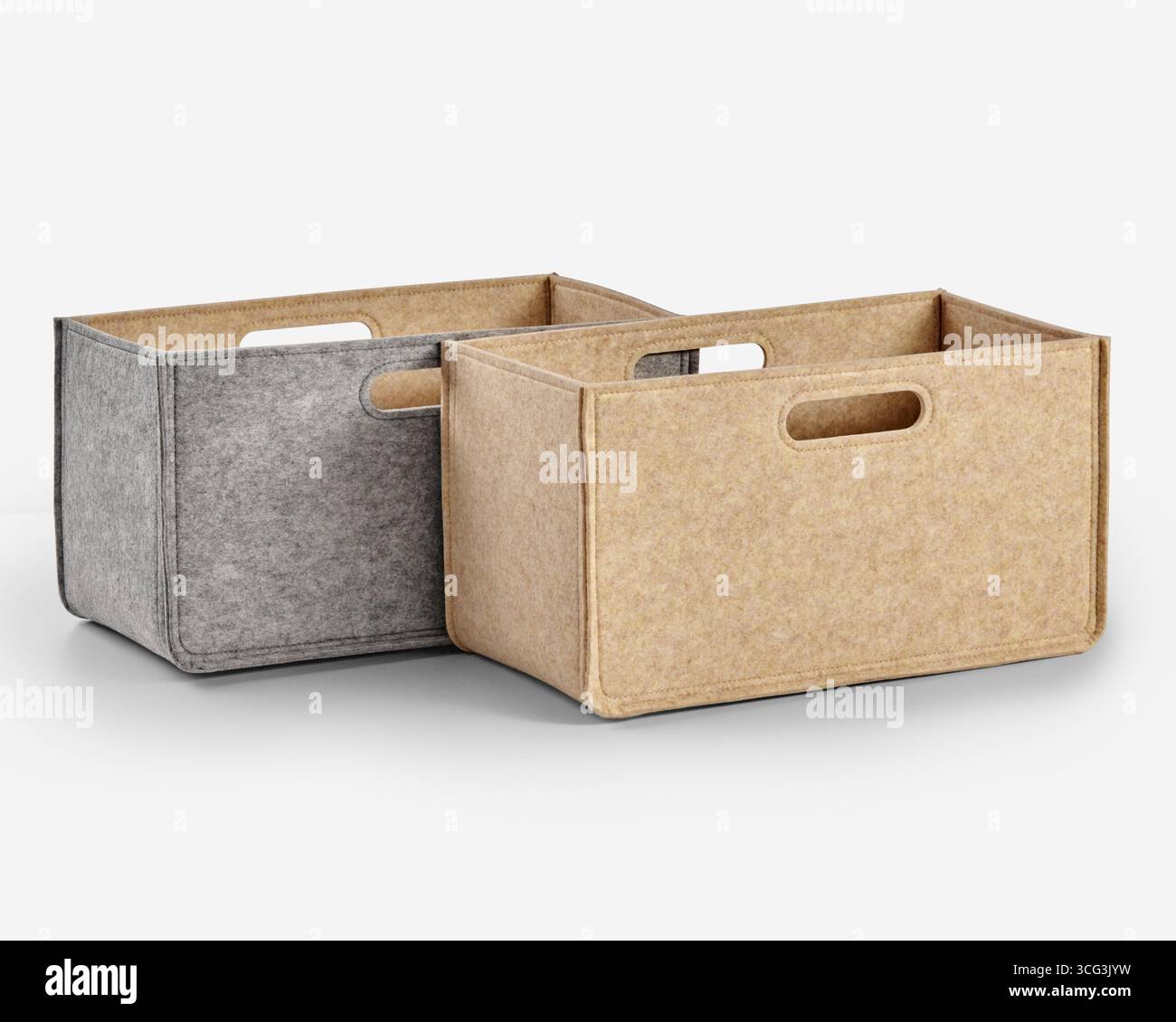 Two empty felt storage boxes with handles for organizing clutter Stock Photo