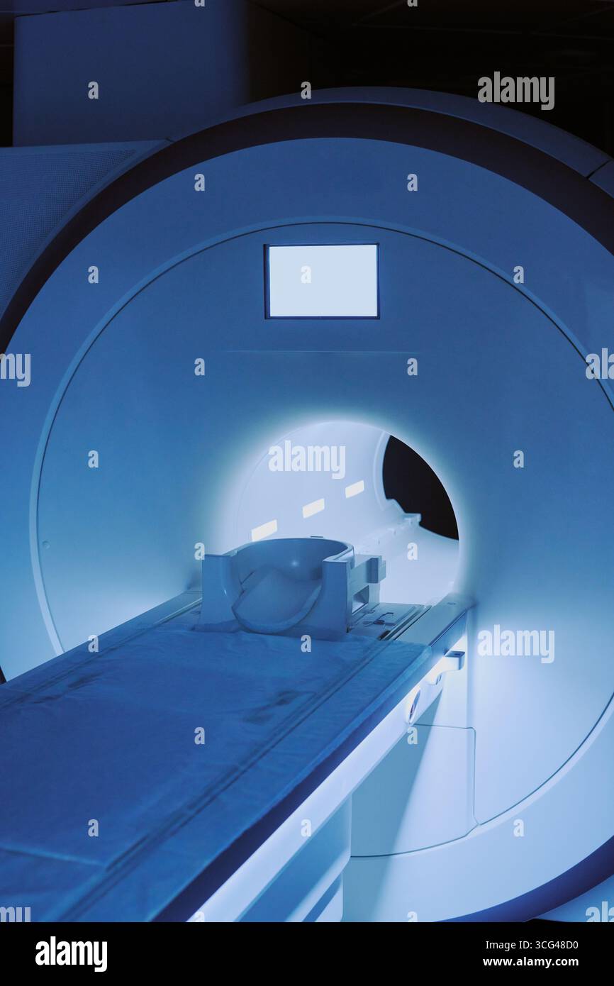 Medical Imaging Equipment Illuminating Diagnostic Room during Night Operation Stock Photo
