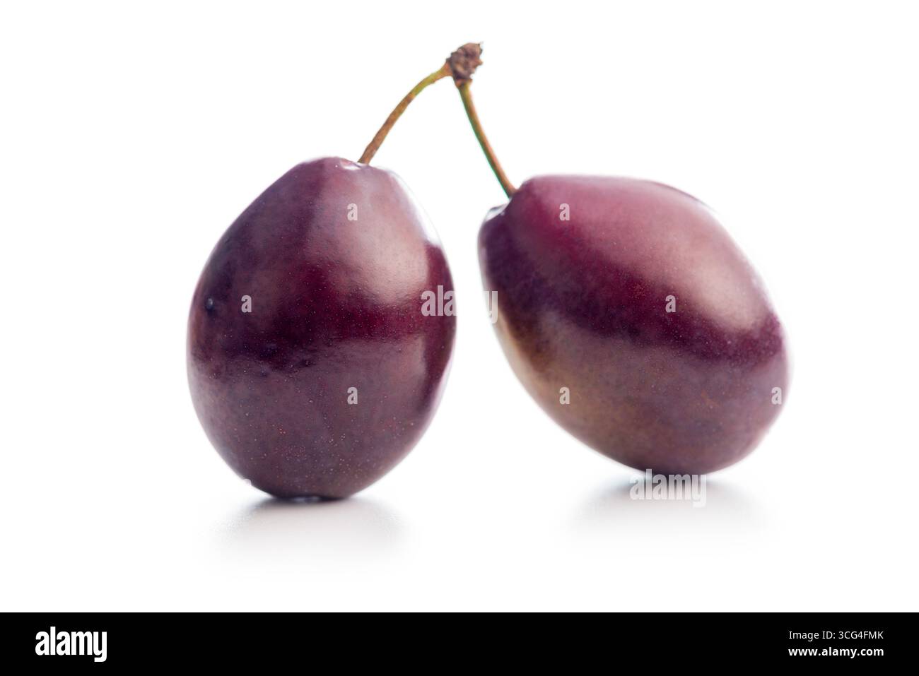 Ripe plums isolated on a white background. Stock Photo