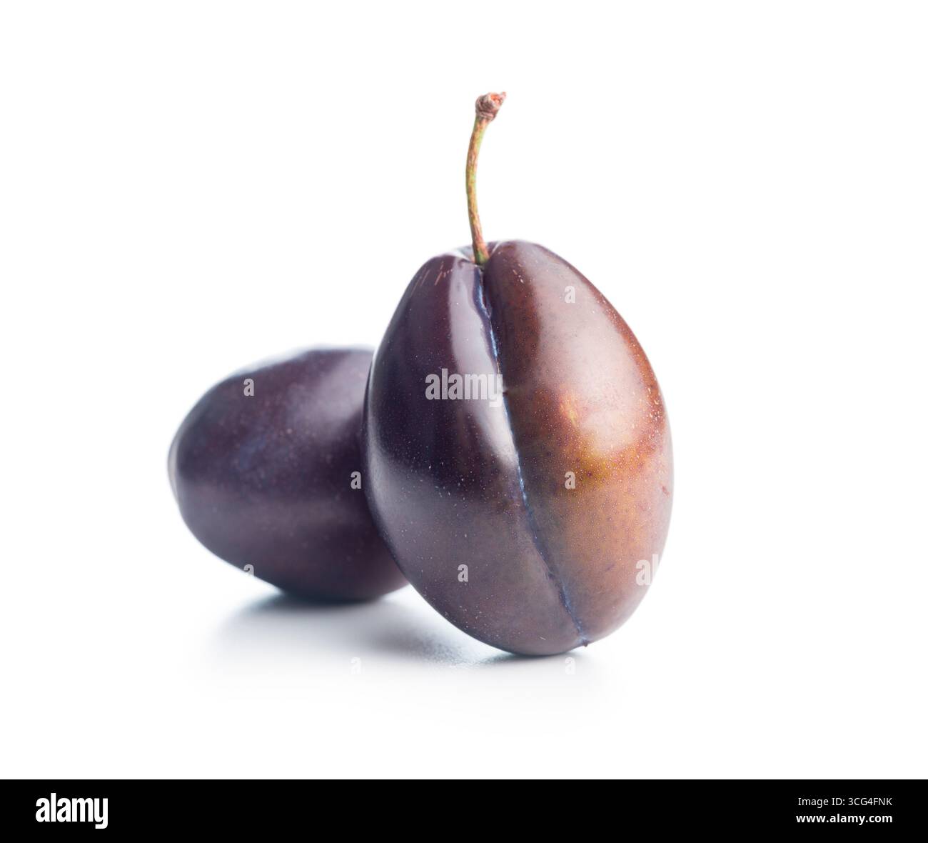 Ripe plums isolated on a white background. Stock Photo