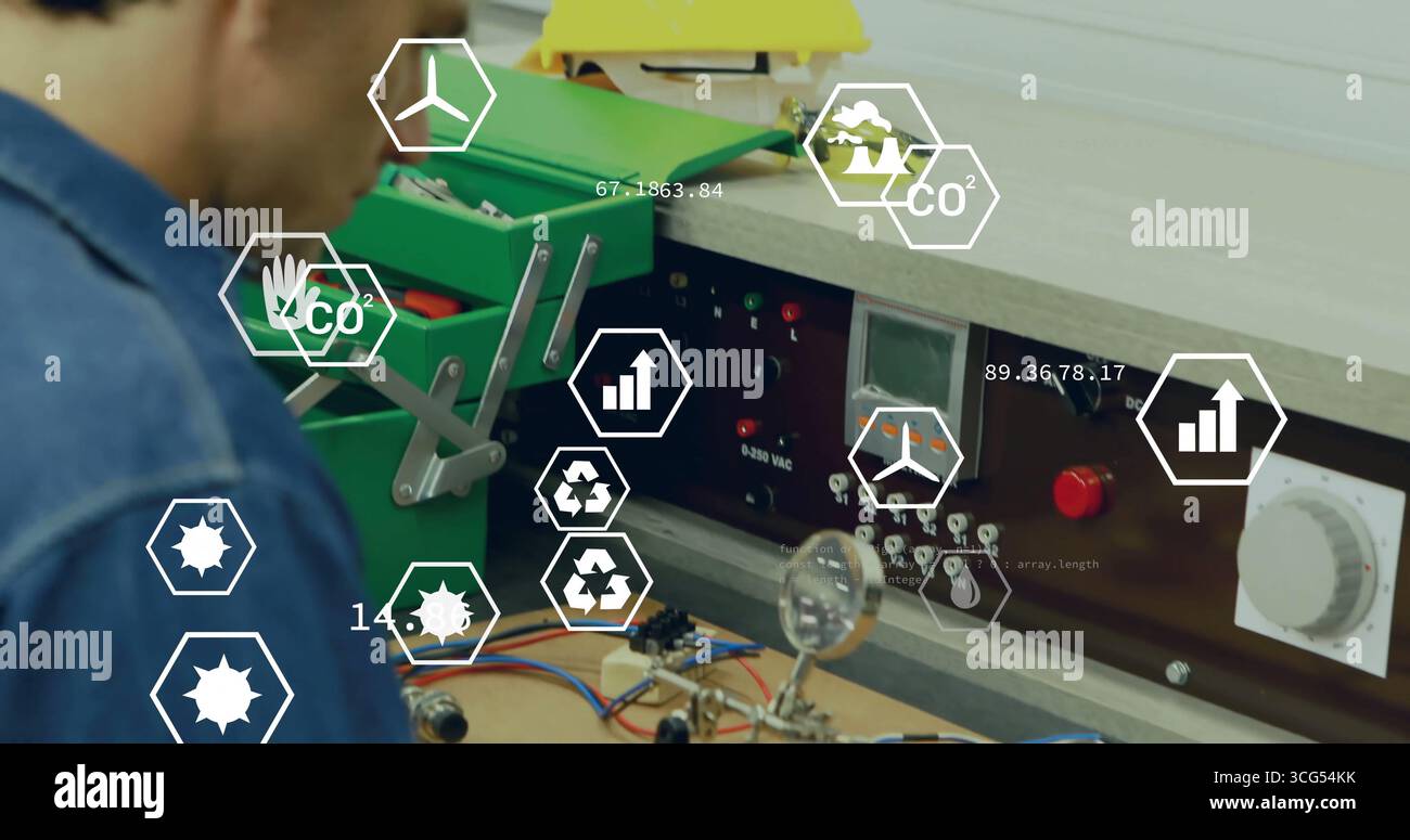 Assembling technician testing circuit board at bench, with green toolbox and AR icons, copy space Stock Photo