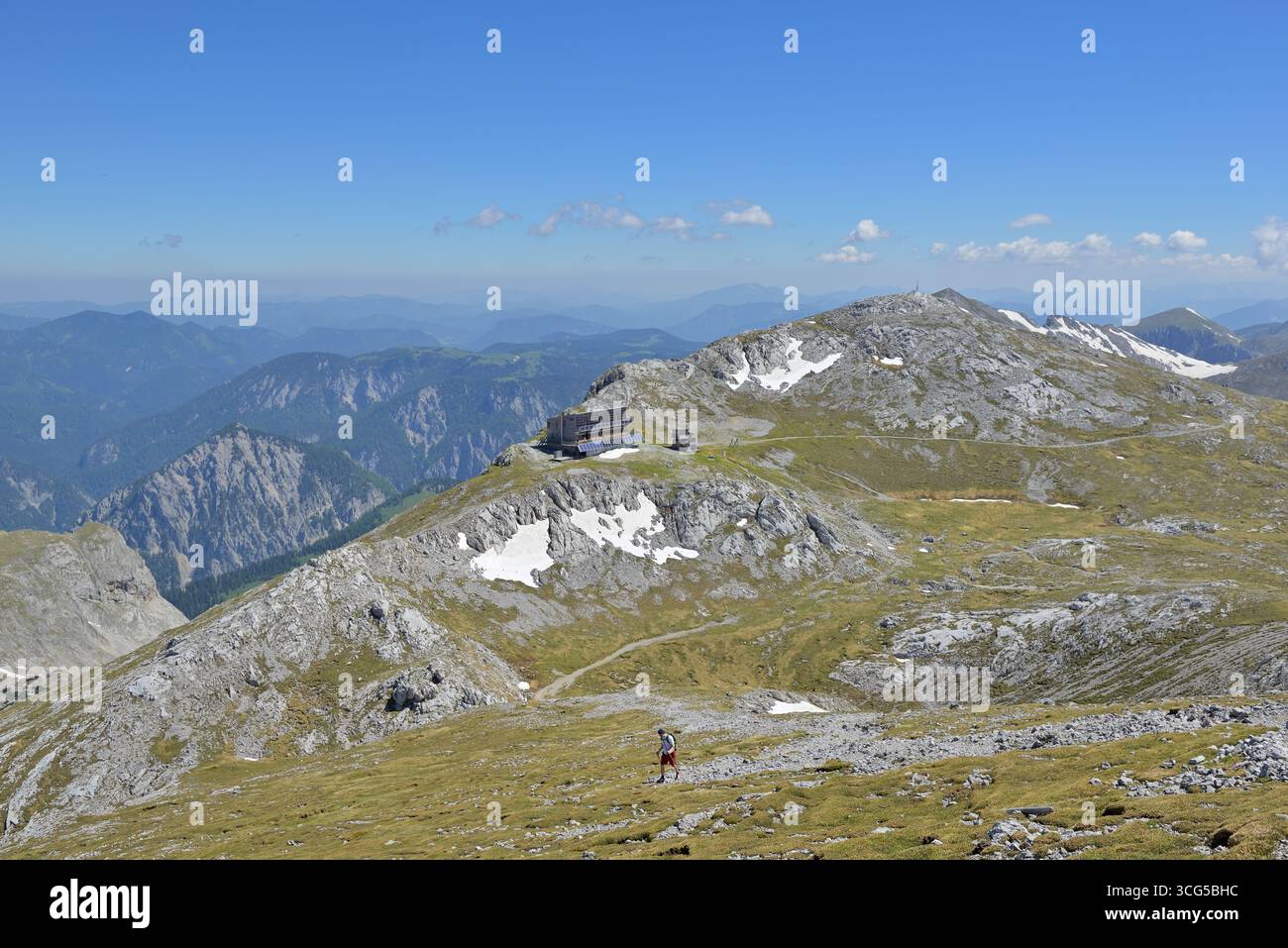 Wide panorama capturing serene mountain ridges, barren alpine ...