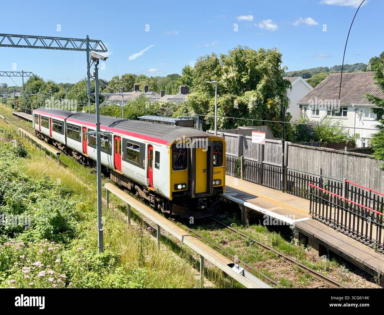 Rhiwbina, Cardiff, Wales, UK - 8 July 2025: Transport for Wales Class 150 diesel commuter train stopping at Rhiwbina railway station - Smartphone Captured Stock Image