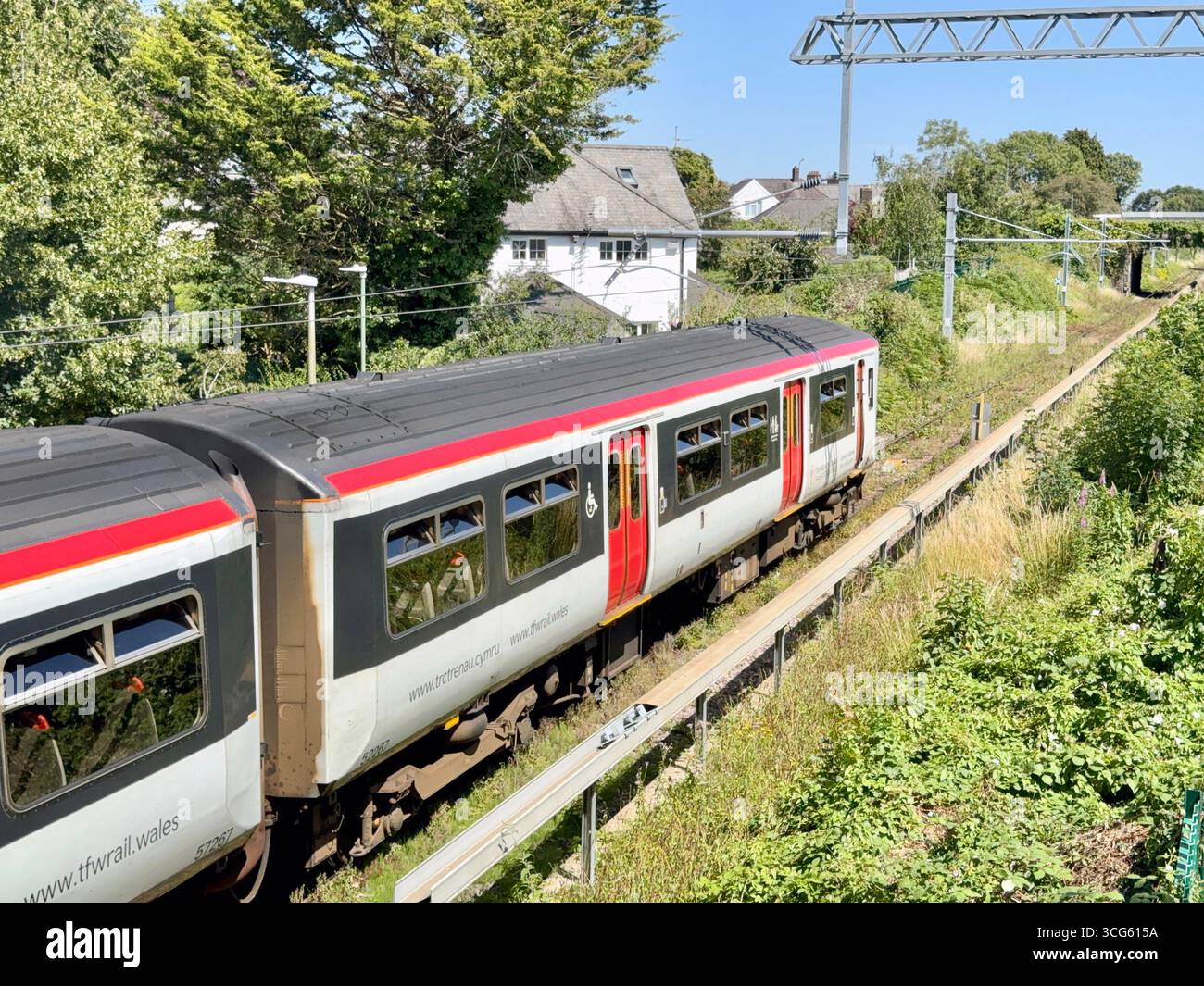 Rhiwbina, Cardiff, Wales, UK - 8 July 2025: Transport for Wales Class 150 diesel commuter train leaving Rhiwbina railway station on the Coryton branch - Smartphone Captured Stock Image