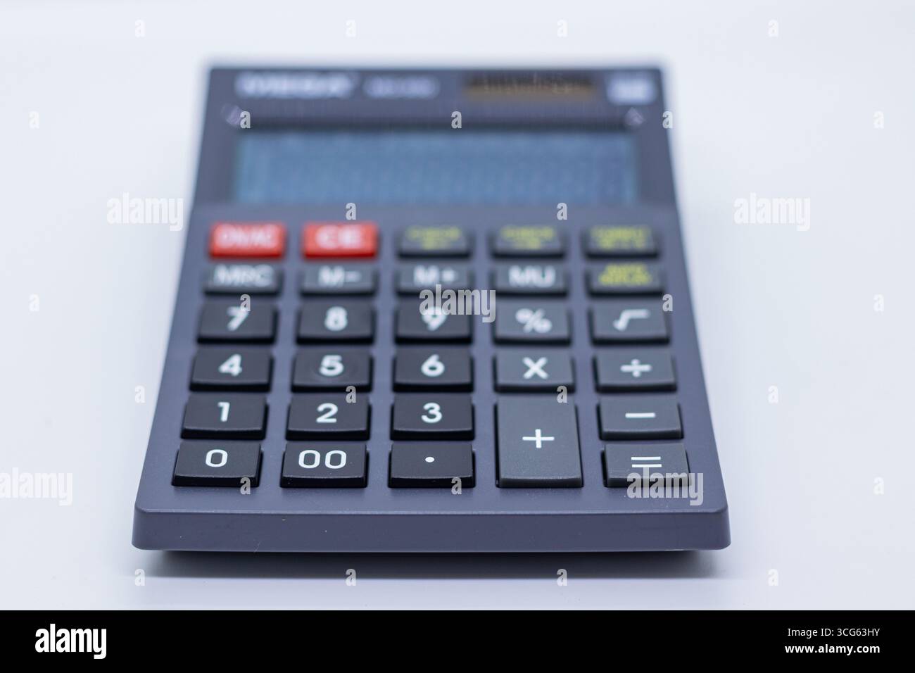 Simple and compact basic calculator designed for students and shopkeepers. Ideal for everyday math calculations, budgeting. Stock Photo