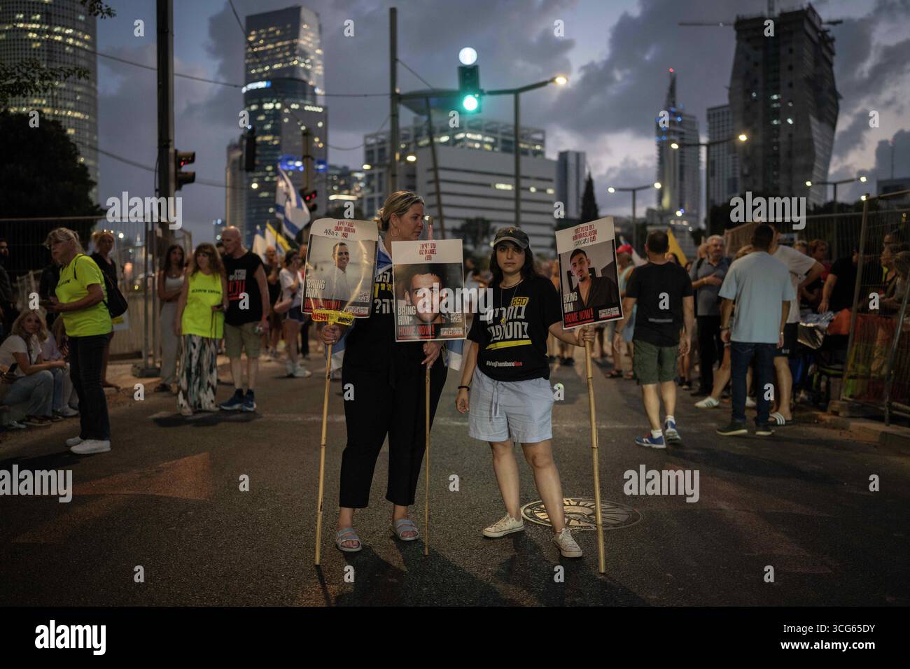 26 August 2025, Israel, Tal Aviv: Israeli protesters gather for a a ...