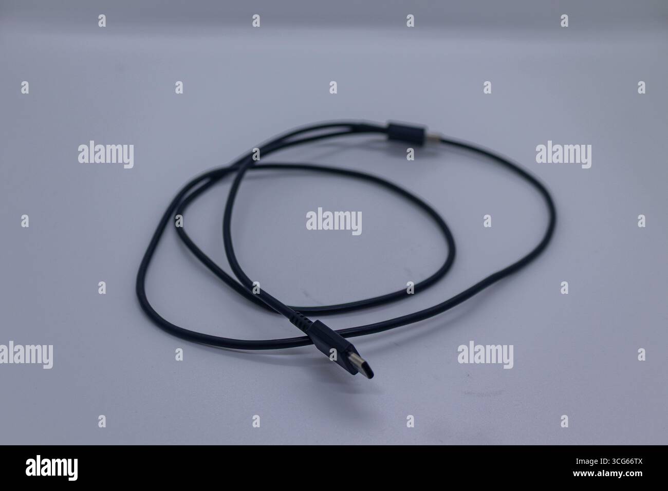 Modern USB-C cable or device compatible with smartphones, laptops, tablets, and other USB Type-C gadgets. Fast charging, data transfer, and universal Stock Photo
