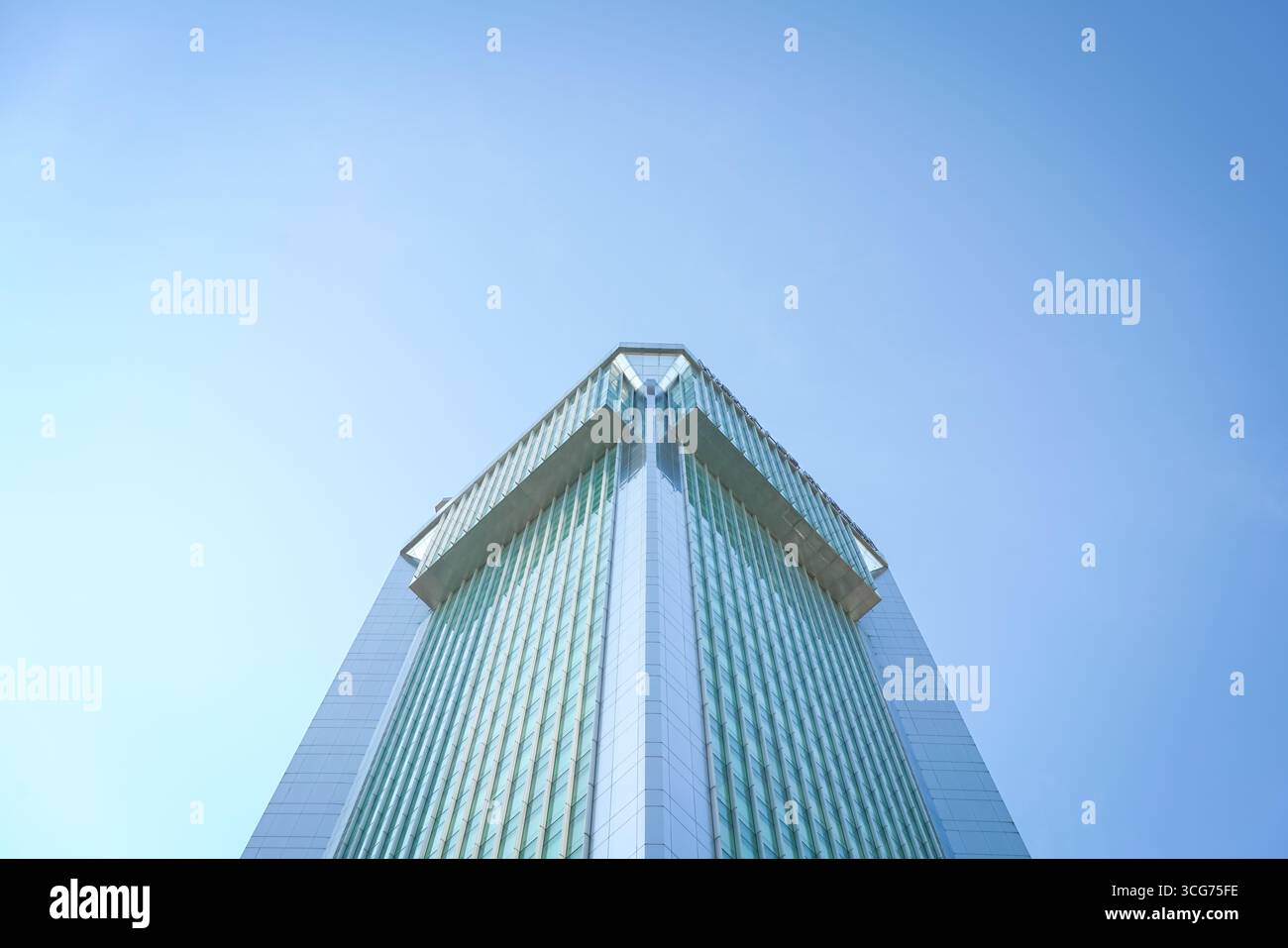 High rise building, against blue sky. Low angle, copy space. Stock Photo