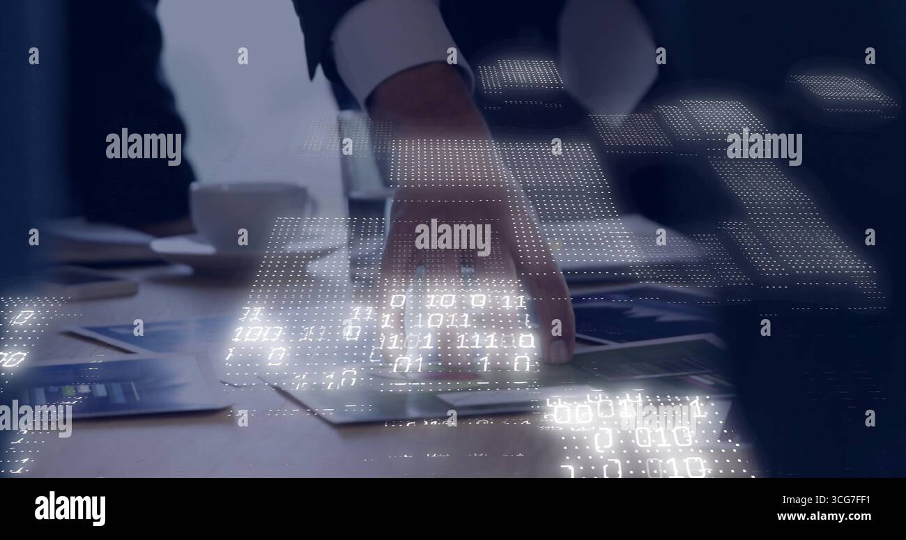 Displaying hand in suit tracing printed charts and graphs at meeting table with binary code overlay Stock Photo