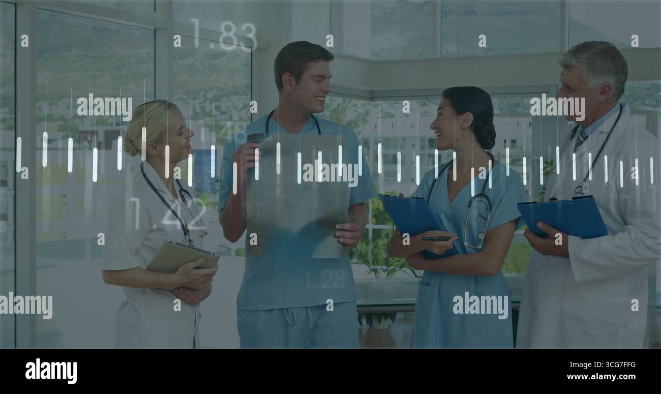 Discussing medical team reviewing X-ray film in hospital corridor, with ...
