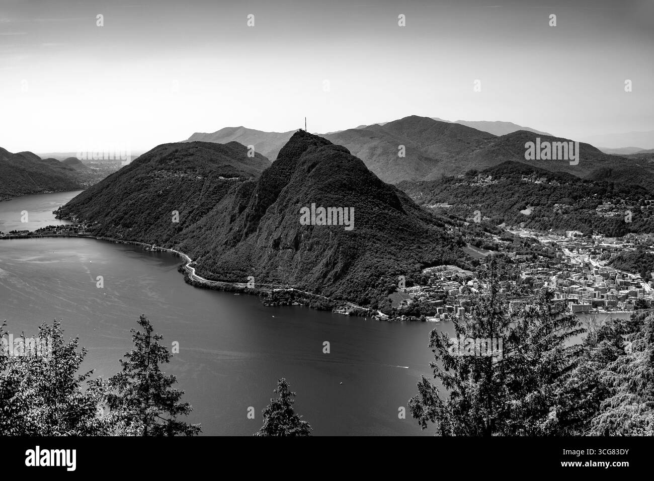 Panoramic View over Lake Lugano and Mountain View and Cityscape in a Sunny Summer Day in Lugano, Ticino, Switzerland. Stock Photo