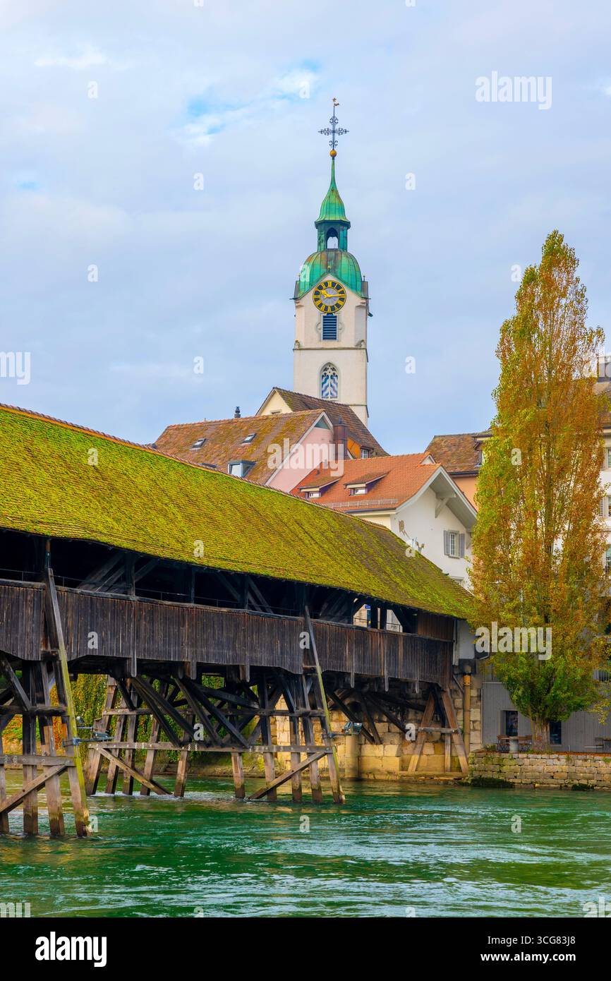 Old Town and the Historical Covered Wood Bridge Holzbr³cke over River Aare in a Sunny Day with Clouds in Olten, Canton Solothurn, Switzerland. Stock Photo