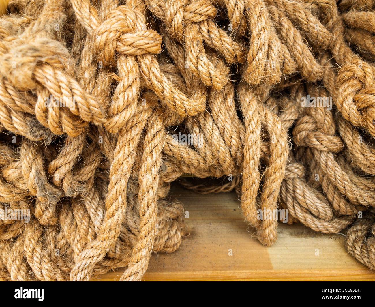 Natural coloured ornamental rope on sale at a UK garden centre. Stock Photo