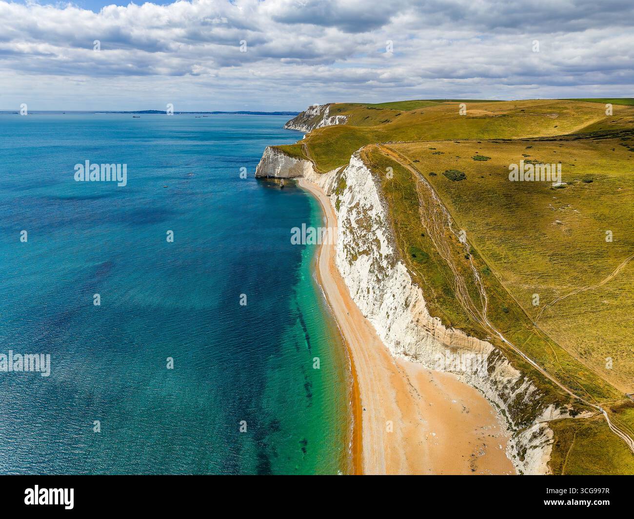Aerial drone view of the white chalk cliffs and beach at Durdle Door ...