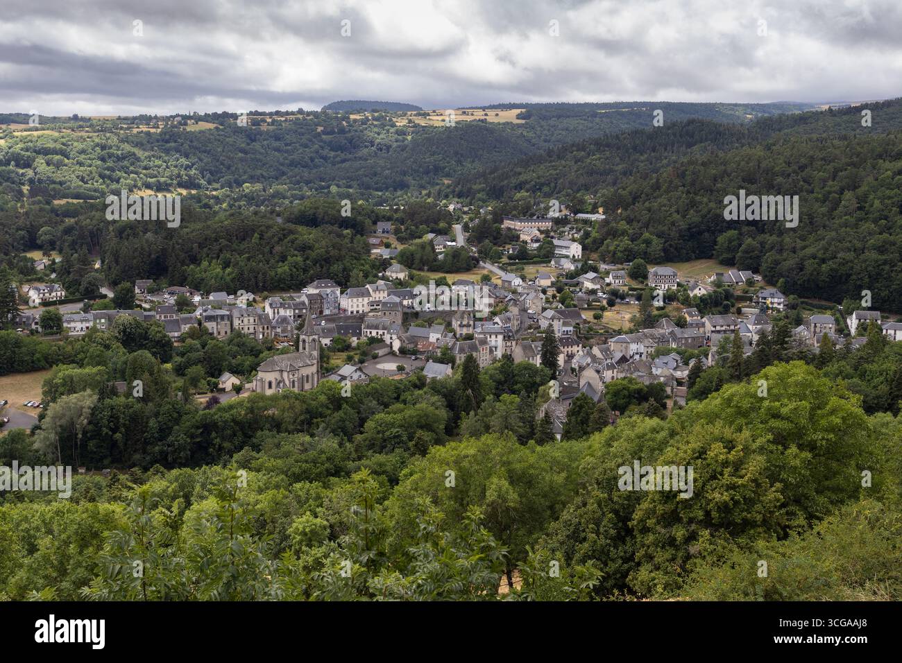 Aerial view of the town of Murol in the summer. Murol is situated in the French department of Puy-de-Dôme, in  Auvergne, in the beautiful volanic area - Stock Image
