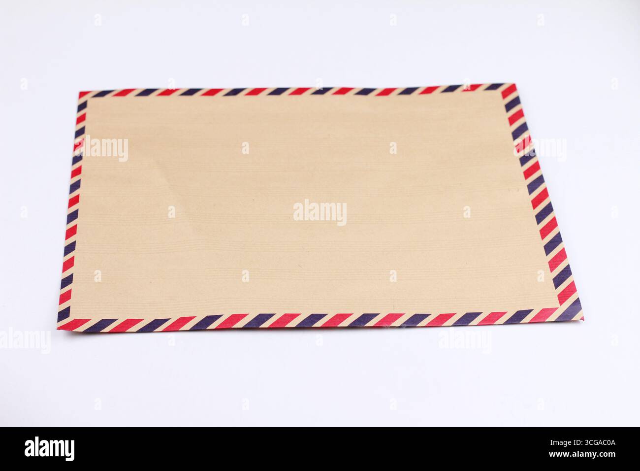 Antique envelope isolated on white background. Stock Photo