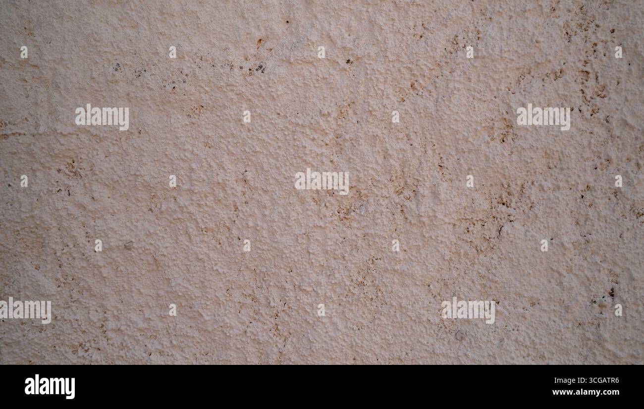 Rustic Plaster Effect Closeup of rustic plaster wall with rough stucco texture, ideal ...