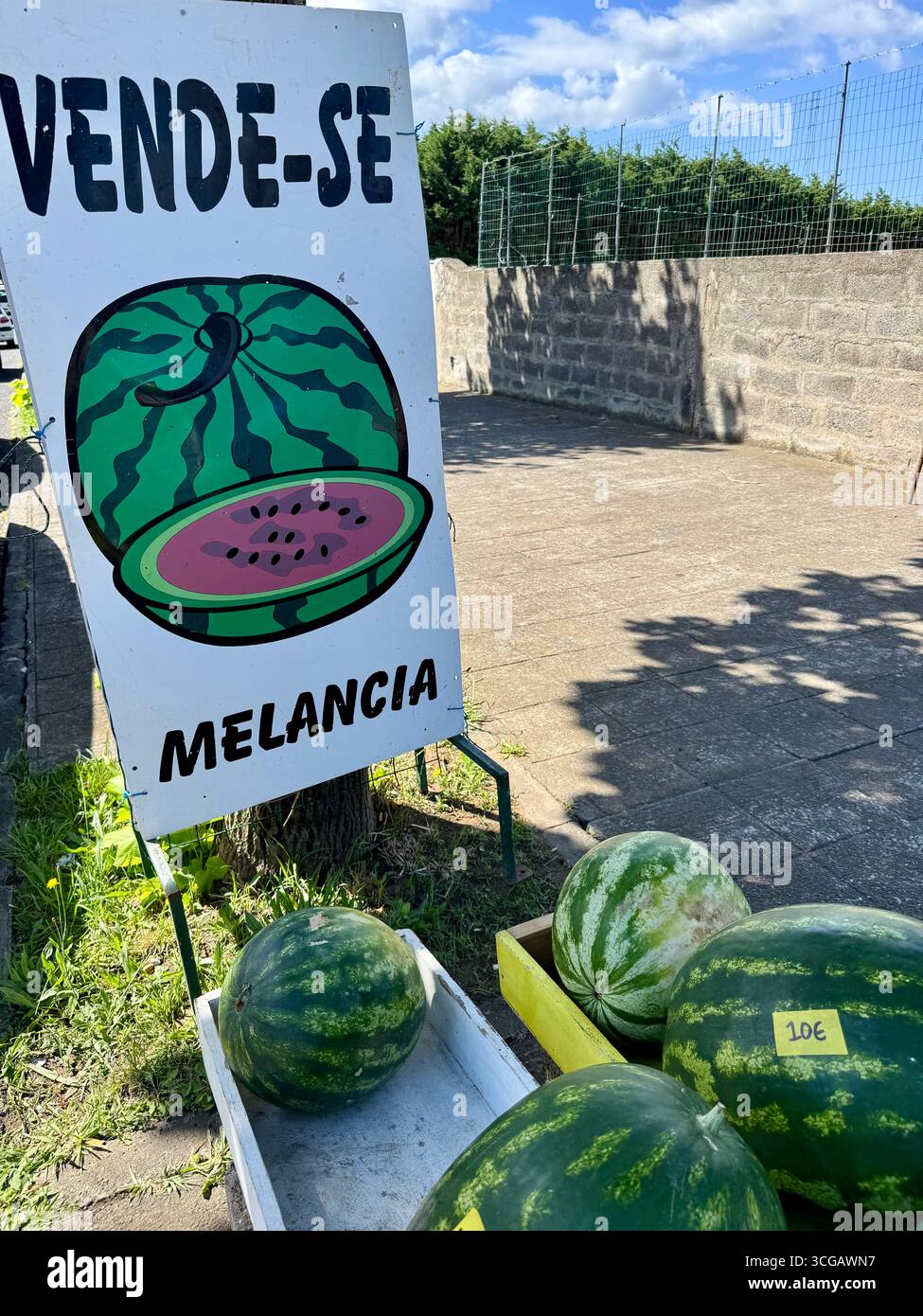 Fresh watermelons for sale at a roadside stand in the Azores, Portugal. - Smartphone Captured Stock Image