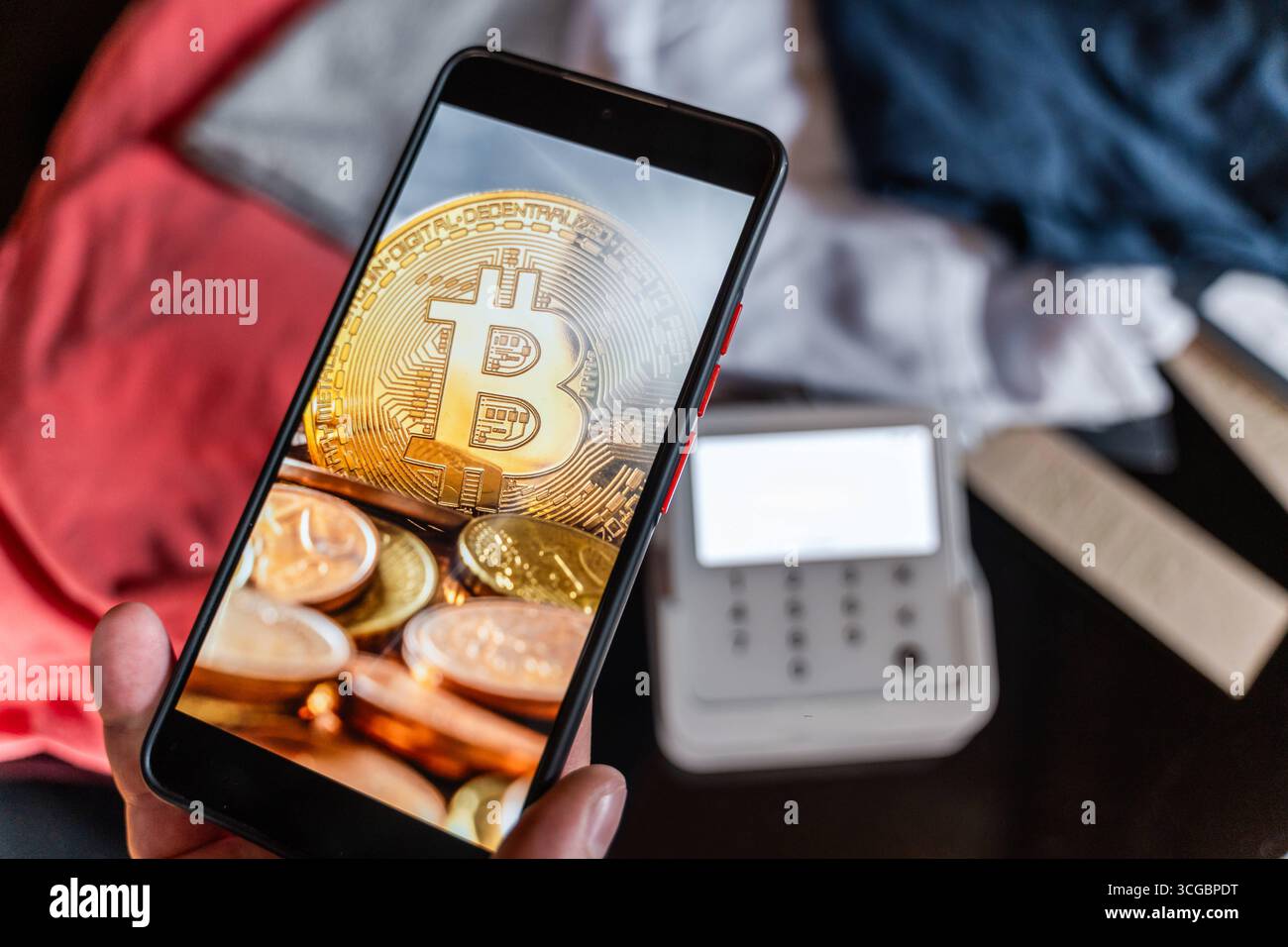 The coins of bitcoin are in front of logo of Ku Coin crypto stock exchange  background. In the foreground is a BTC coins and on the background is a  Stock Photo -