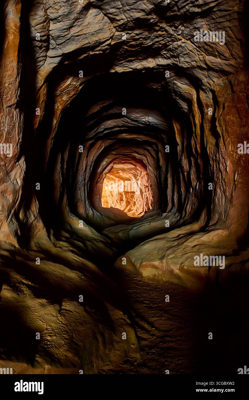 Belly of the Dragon Cave Tunnel with Illuminated Exit and Rocky Path ...