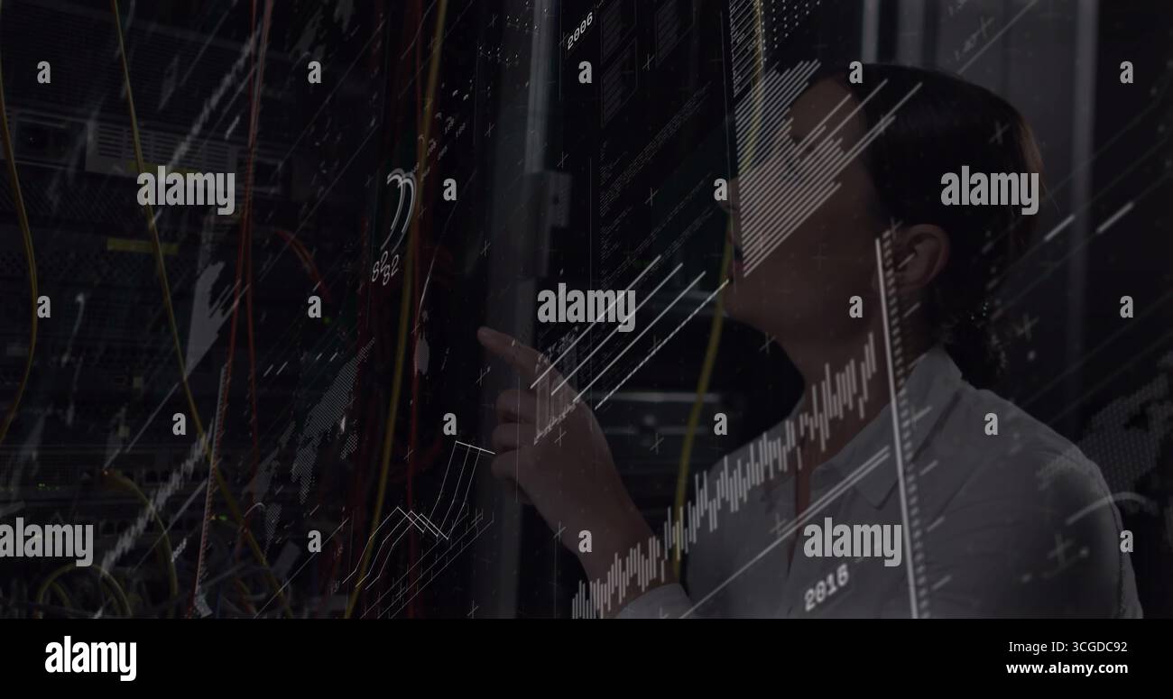 IT technician inspecting server rack in server room, with patch cables, digital graphs, copy space Stock Photo