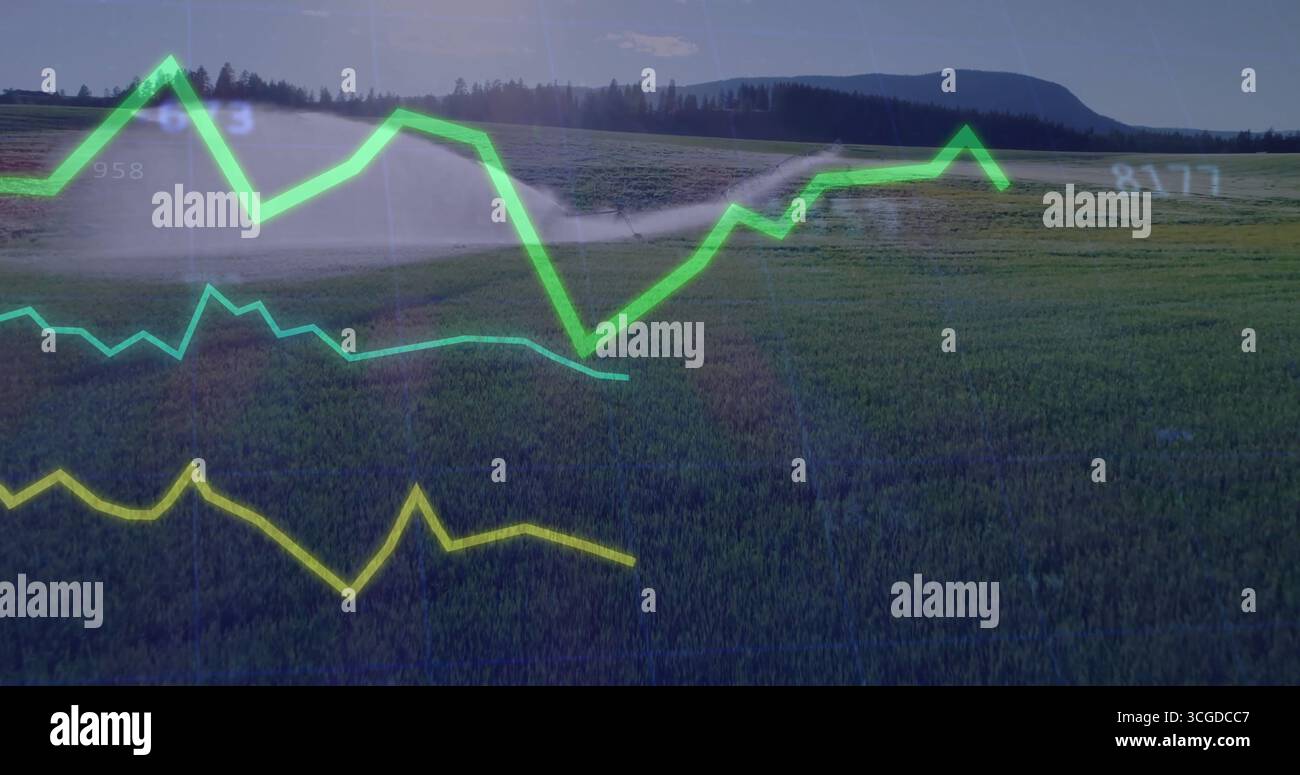 Spraying center pivot irrigation sprinkler arm watering cereal crops at farm, with numeric overlays Stock Photo