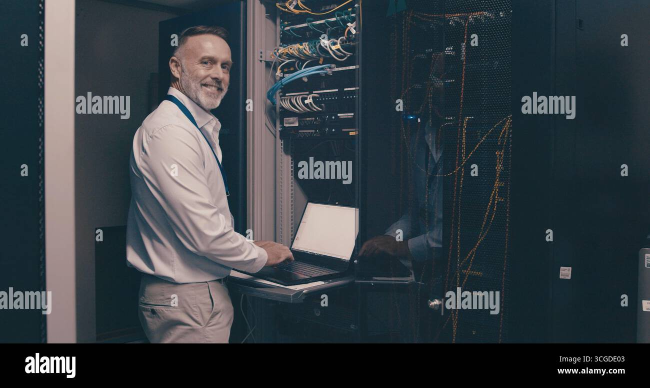 Laptop, portrait and network with man in server room for data center, technician or systems. Cybersecurity, software database and cloud computing with Stock Photo