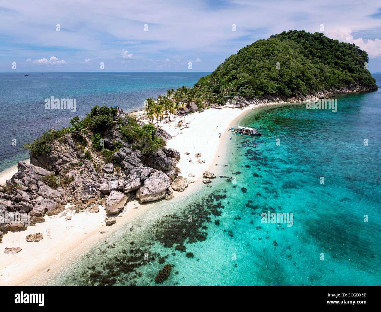 Aerial view of vibrant turquoise waters meet pristine white sands and ...