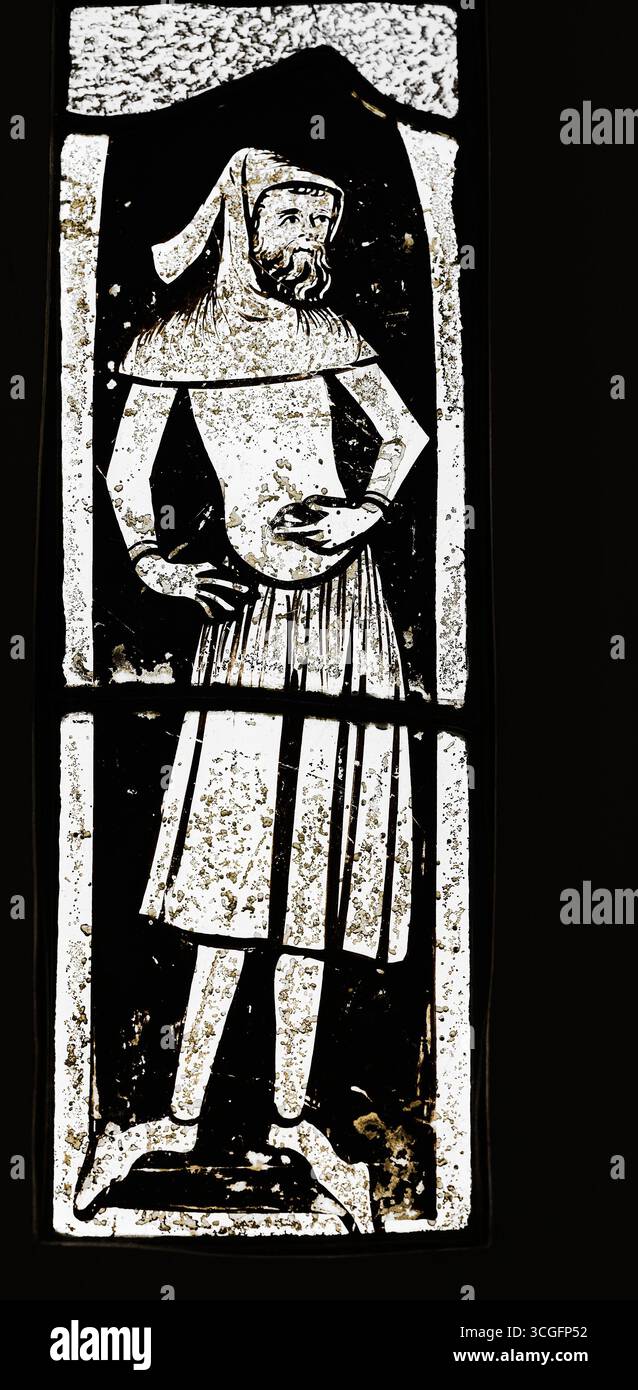 medieval stained glass window, of a peasant. Stock Photo