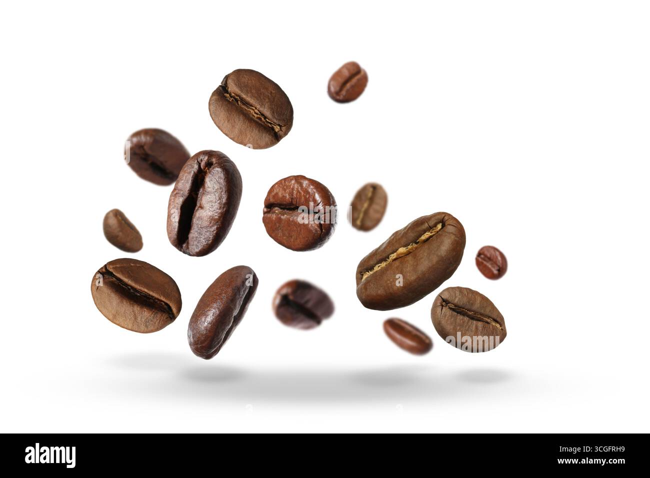 Roasted coffee beans falling against white background Stock Photo - Alamy