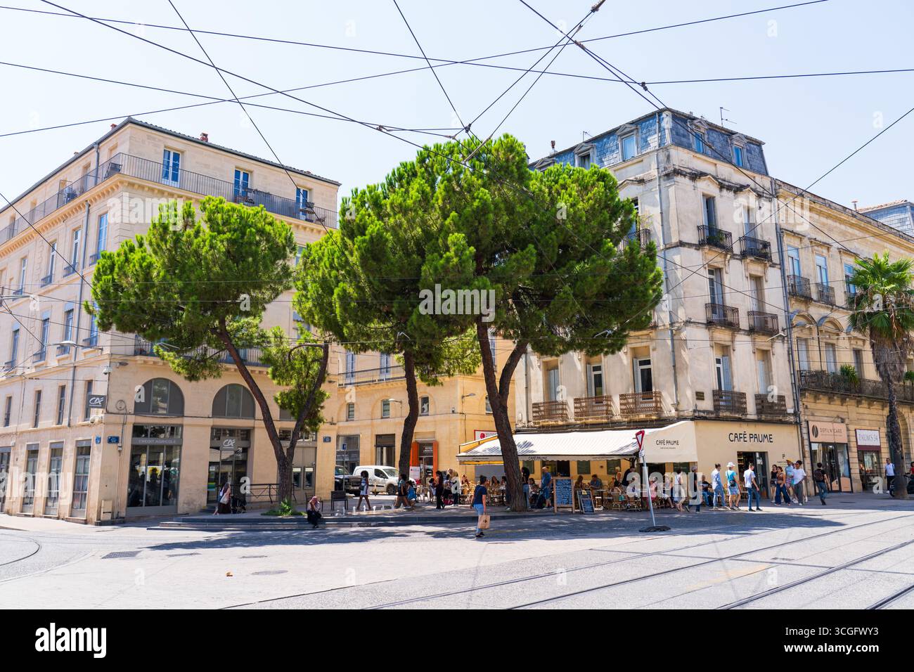 Montpellier, France - August 8th 2025: Boulevard Jeu de Paume near Place Edouard Adam, with the lightrail line, restaurants and typical buildings Stock Photo