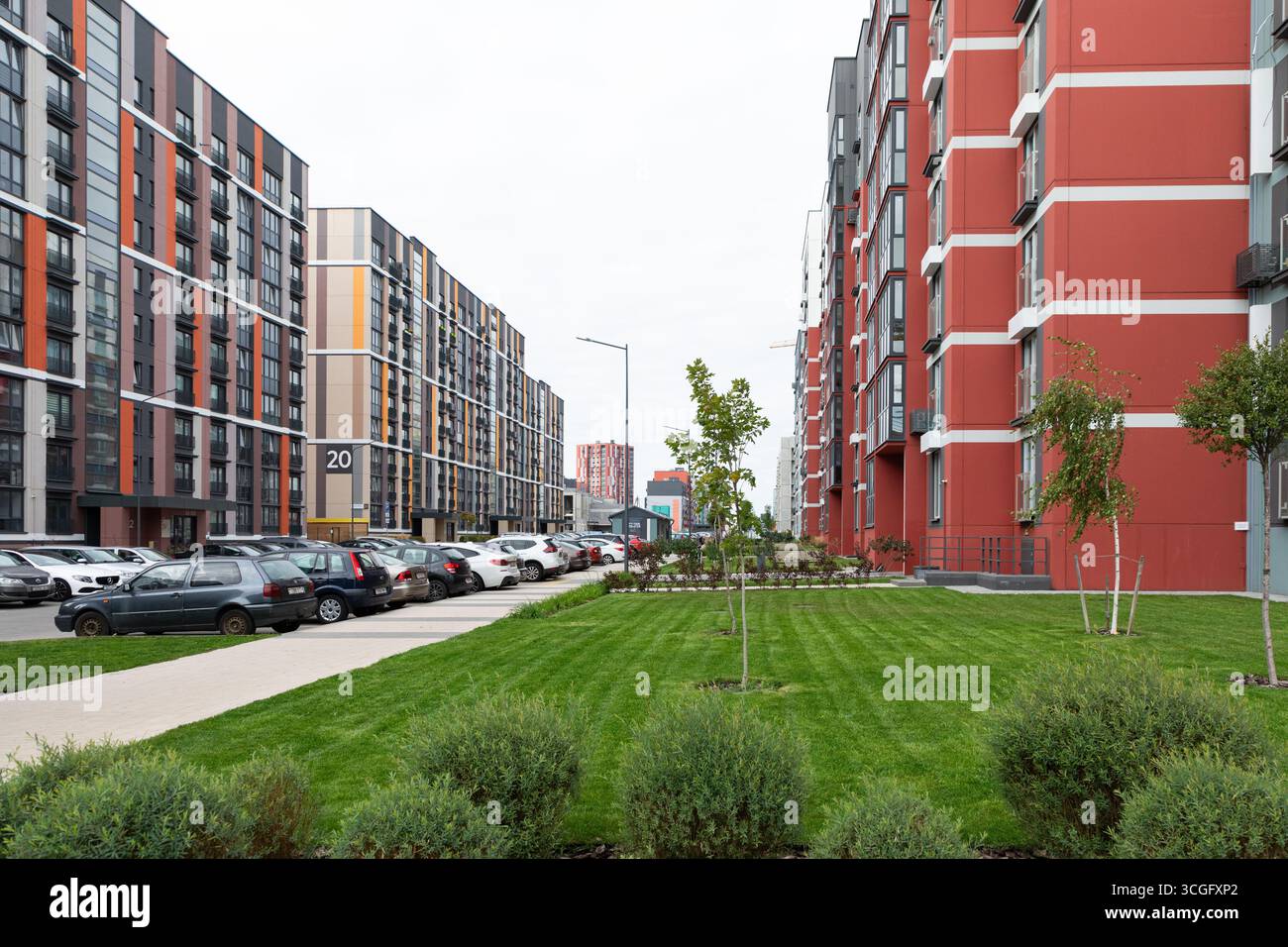 View of modern high-rise apartment buildings in a bustling residential ...