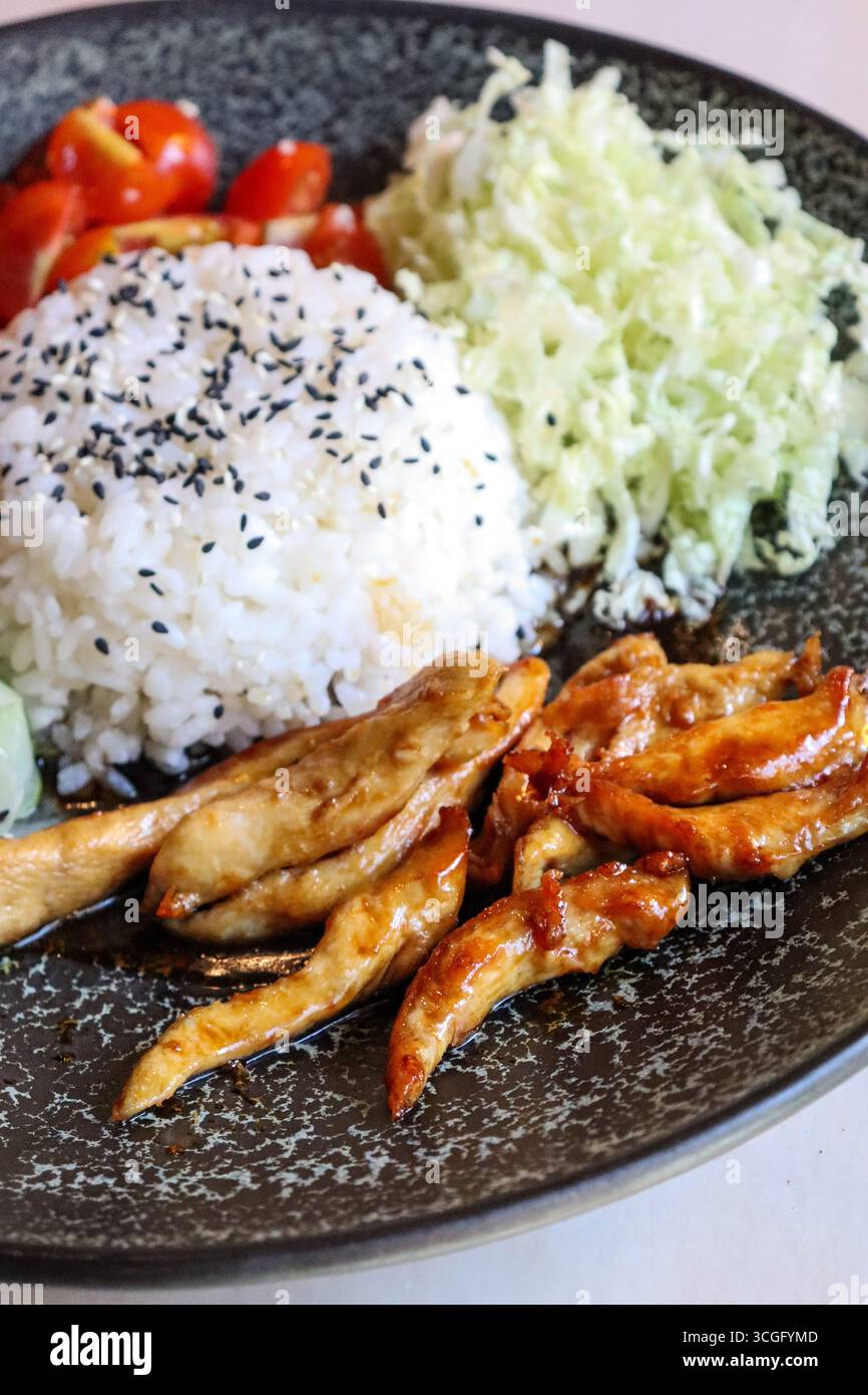 Domed Rice A serving of Japanese chicken teriyaki with a dome of steamed white ...