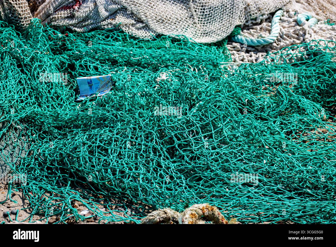 green and white trawl ropes and nets with drawn ropes and footrope ...
