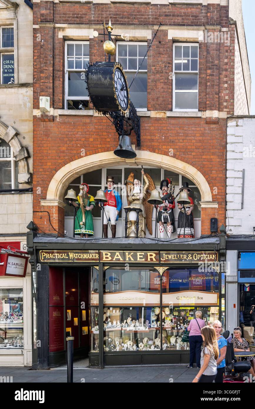 Bakers mechanical clock and striking figures over G A Baker & Son shop in Southgate Street,  Gloucester, Goucestershire, UK on 22 August 2025 Stock Photo
