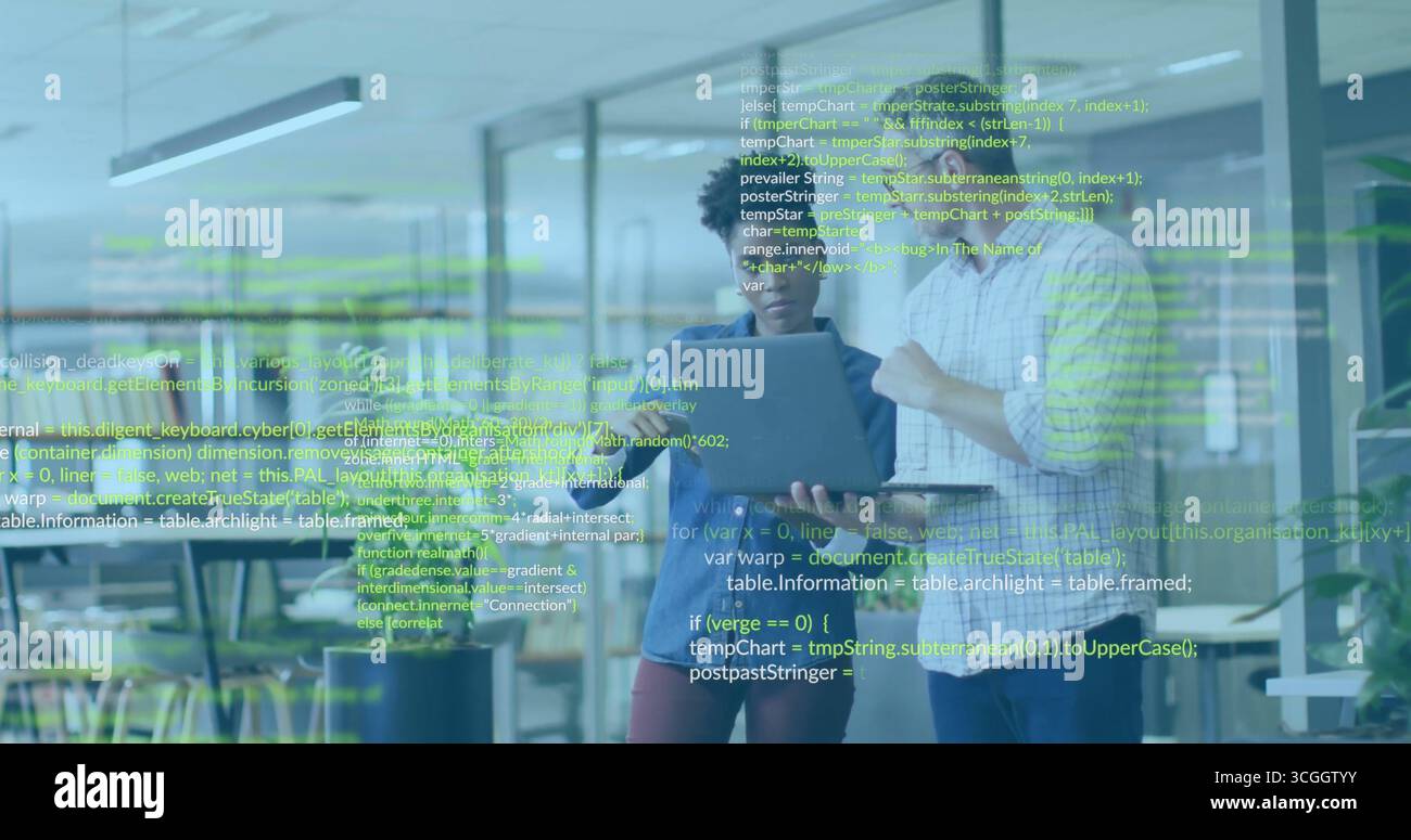 Reviewing code, professionals viewing laptop with green code overlay in office with monitors Stock Photo