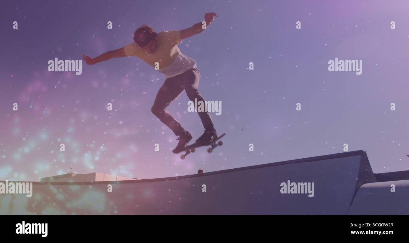 Jumping male skateboarder doing trick at skate park, with skateboard ...