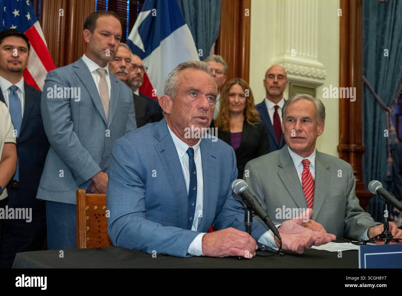 Austin, United States. 28th Aug, 2025. U.S. Secretary of Heath and Human Services (HHS) ROBERT F. KENNEDY, JR. speaks to the press about Texas' health care initiatives in a press conference with Texas Governor GREG ABBOTT (r) at the Texas Capitol on August 28, 2025. Kennedy is facing questions about his role in recent Centers for Disease Control (CDC) shakeups. Credit: Bob Daemmrich/Alamy Live News Stock Photo